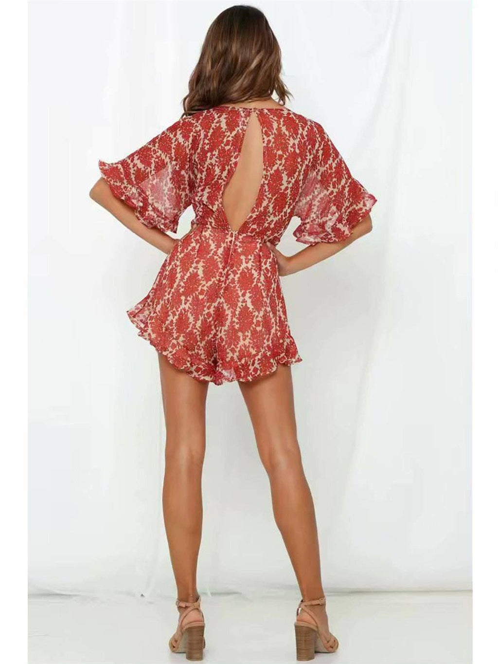 Playsuit mit V-Ausschnitt und Rückendetail in Orange mit Blumenmuster