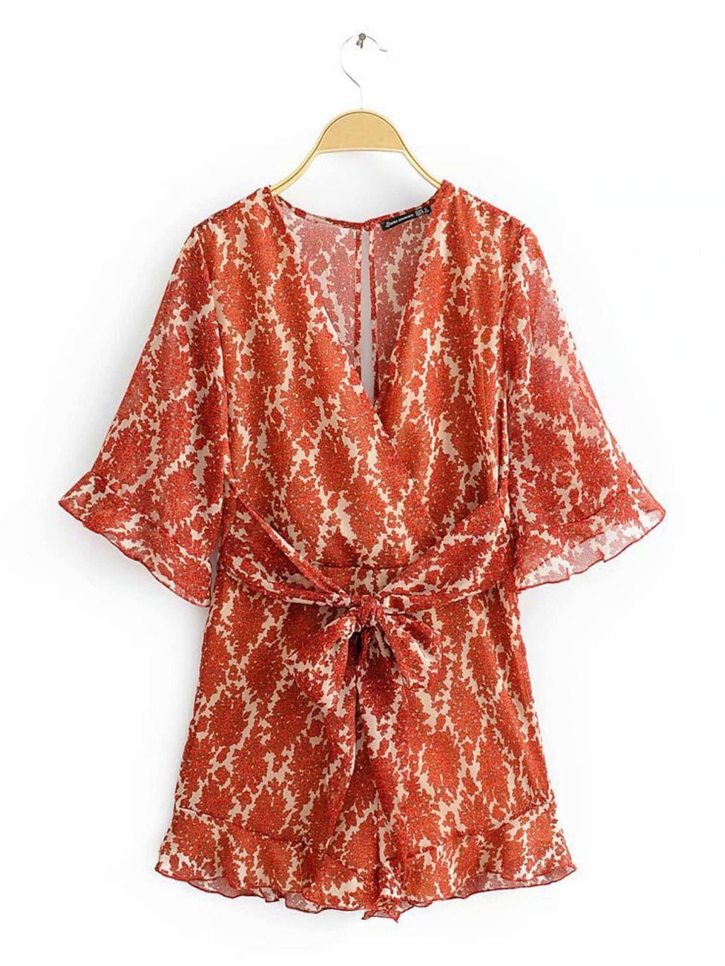 Playsuit mit V-Ausschnitt und Rückendetail in Orange mit Blumenmuster