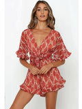 Playsuit mit V-Ausschnitt und Rückendetail in Orange mit Blumenmuster