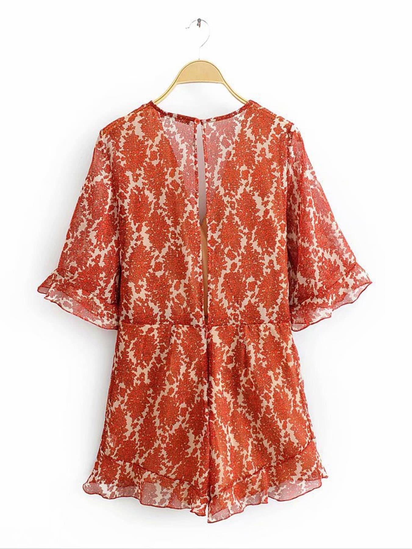 Playsuit mit V-Ausschnitt und Rückendetail in Orange mit Blumenmuster