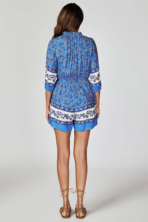 Blauer Boho-Playsuit mit Blumendruck und Knöpfen